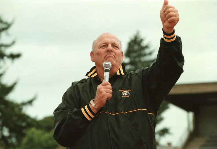 Frosty Westering giving a thumbs up while holding a microphone